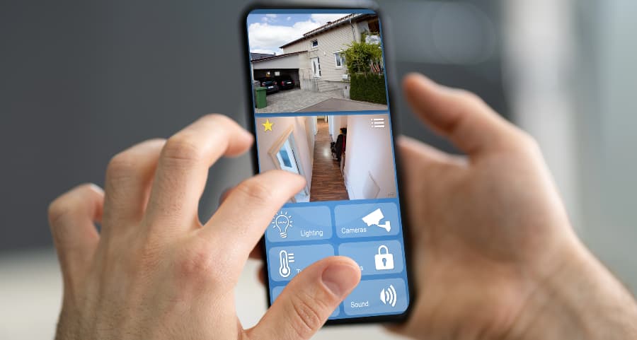 Person looking at video camera streams on a cell phone
